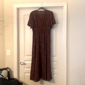 MIDI length dress, with flutter sleeves.